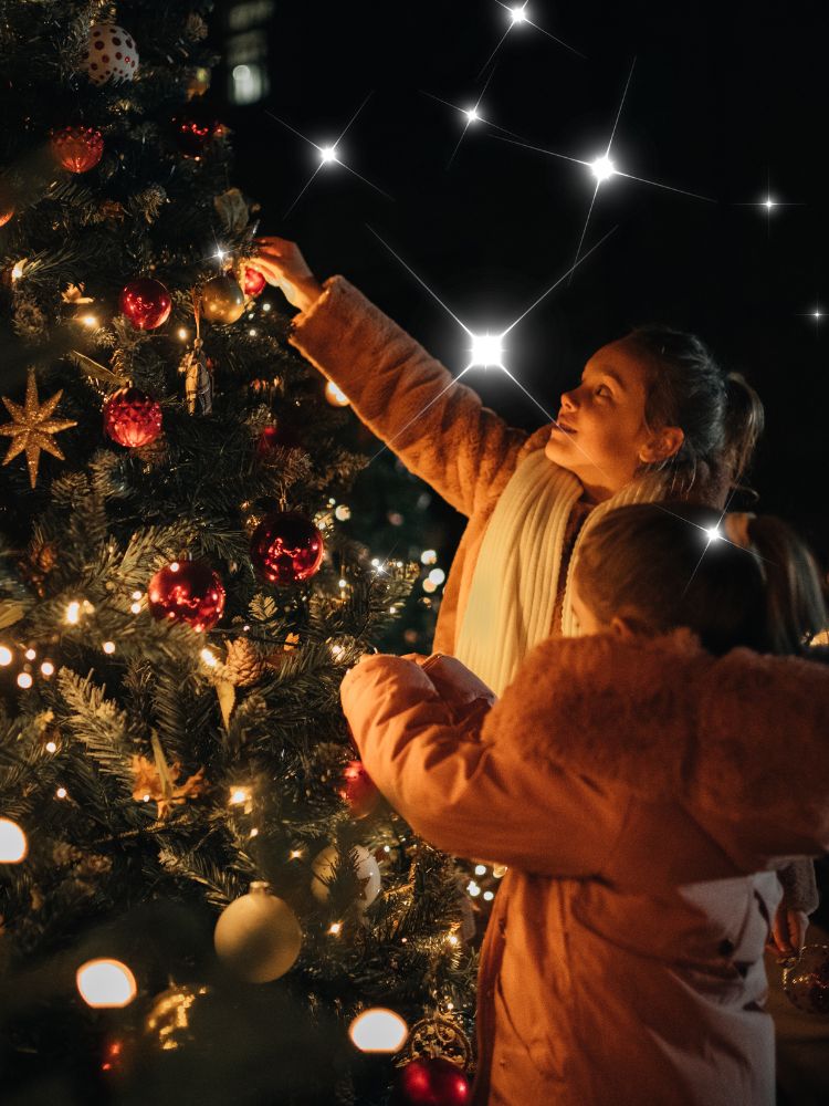 family decorating christmas tree