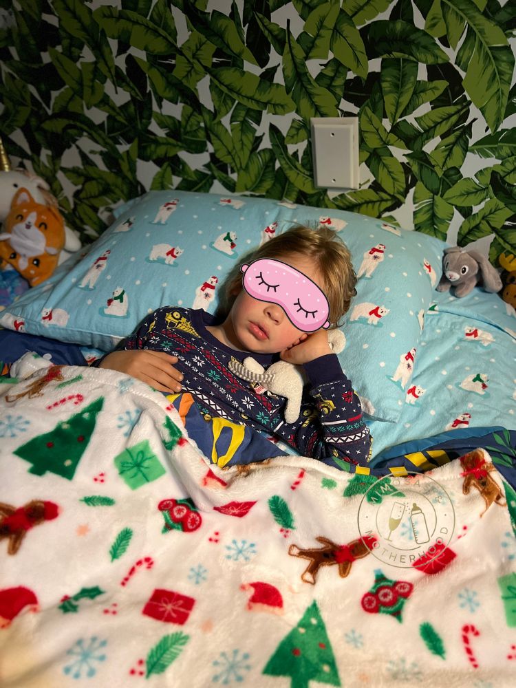 toddler sleeping in their crib