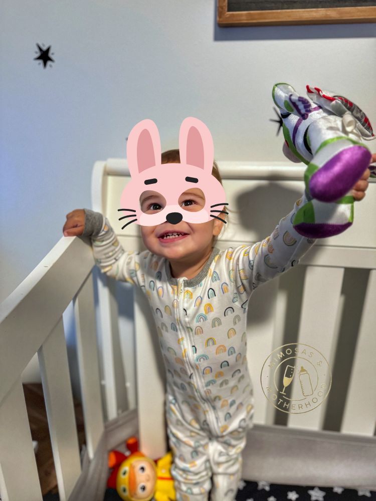 toddler standing in crib