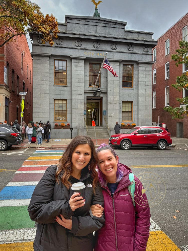image shows two women in front of Salem Massachusetts City Hall