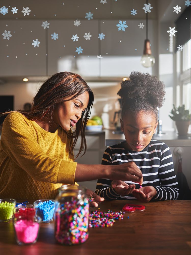 woman and child doing crafts inside