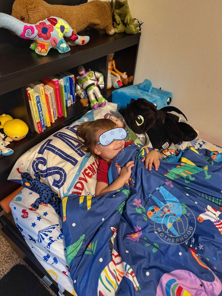 toddler sleeping in their bed