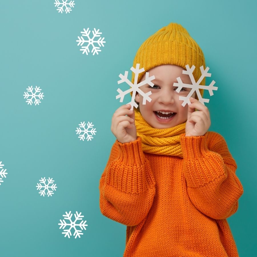 image shows a child with snowflakes