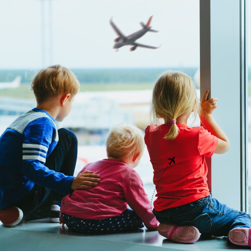 image shows kids at the airport