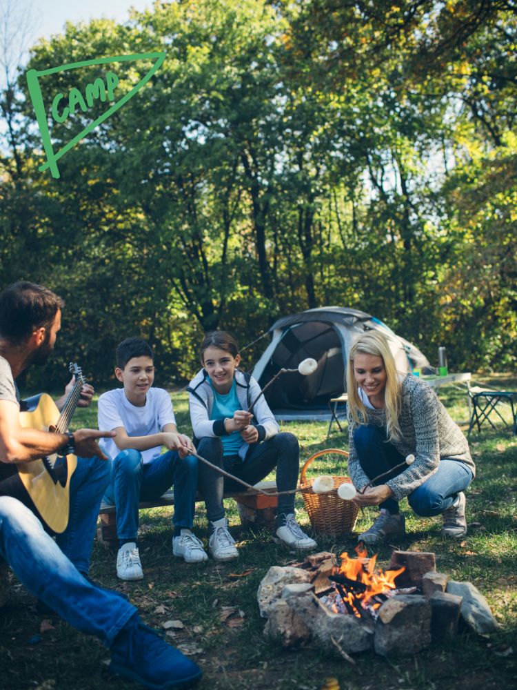 image shows a family camping around a campfire