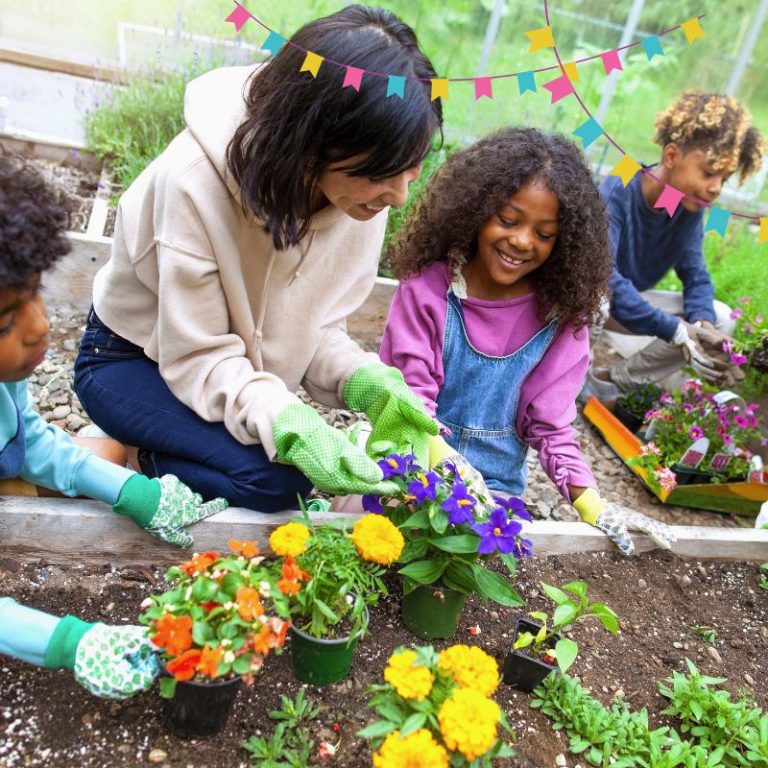 image shows a family planting spring flowers
