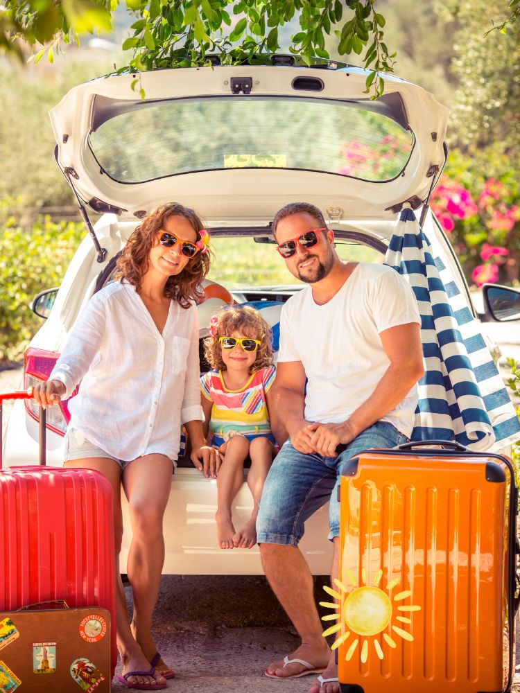 family loading up a car for a trip