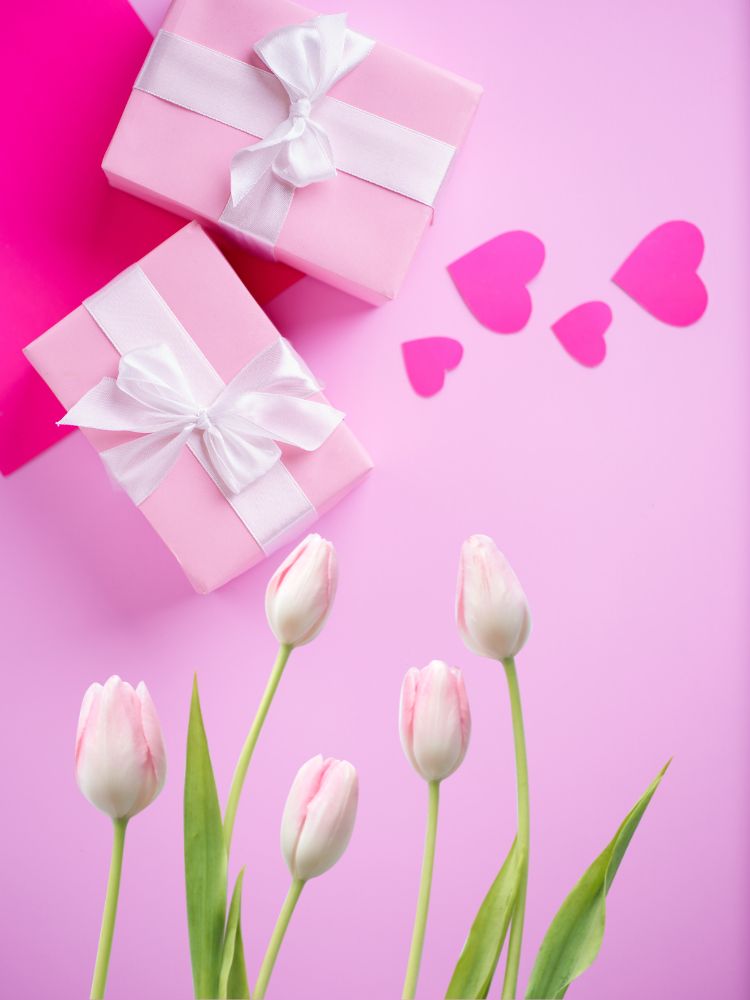 image shows some gifts with hearts and flowers