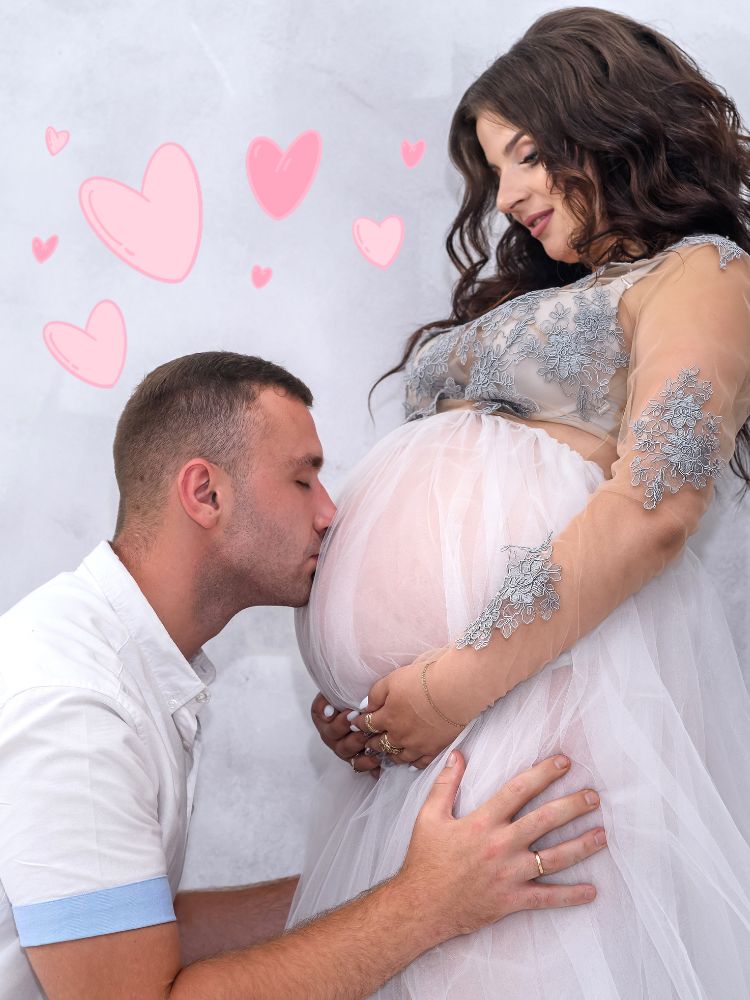 image shows a man kissing a pregnant stomach