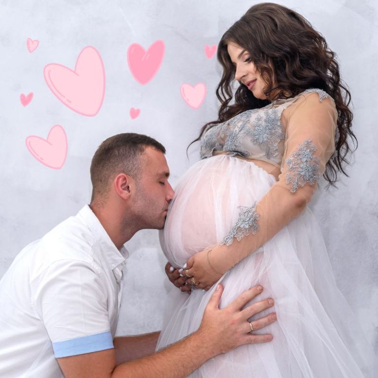 image shows a man kissing a pregnant belly
