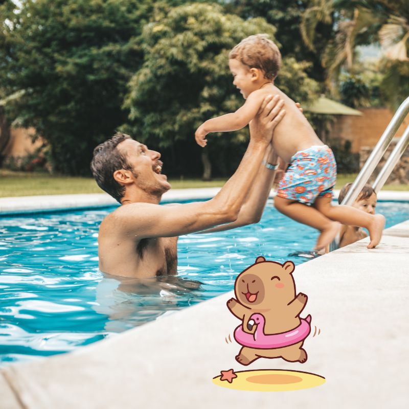 image shows a child playing at a pool with an adult