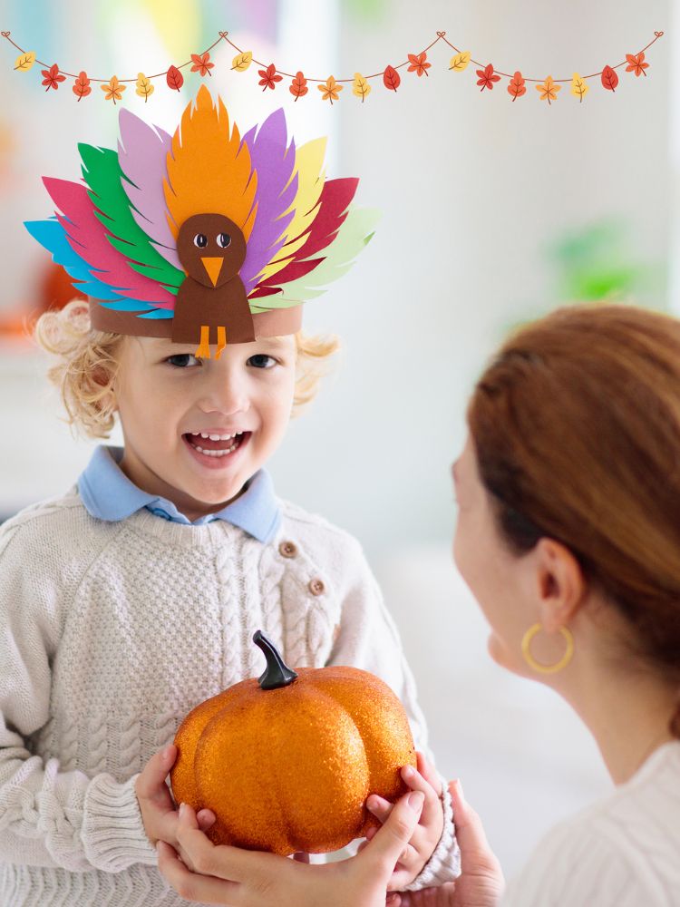 image shows a child with a turkey crown and pumpkin