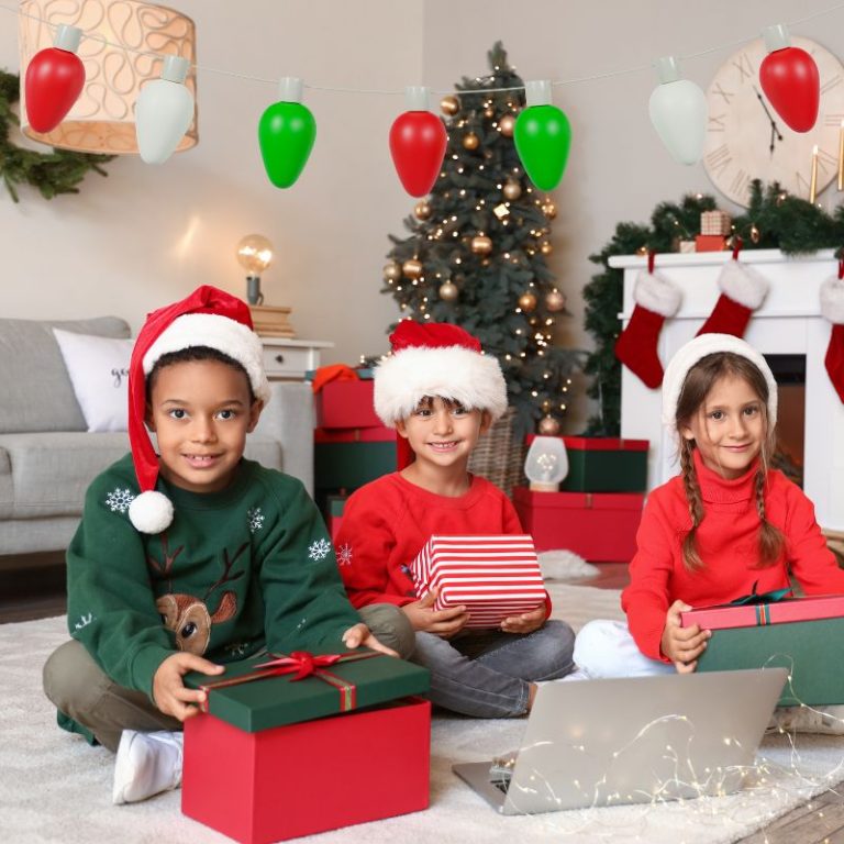 image shows children opening christmas gifts on christmas eve