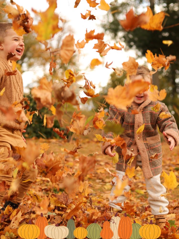 kids playing in autumn leaves