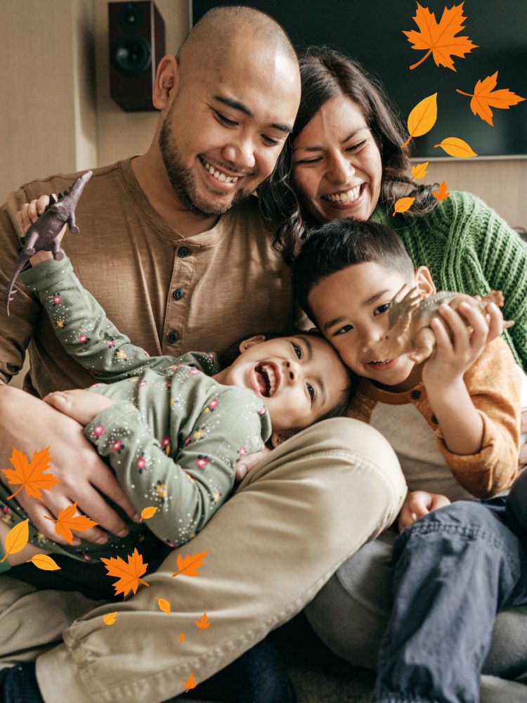 family laughing during fall